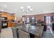 Open floorplan showing the kitchen and dining area with seating for six, perfect for Gathering gatherings at 9457 Alma Ridge Ave, Las Vegas, NV 89178