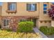 Inviting home exterior featuring a stone facade and well-manicured landscaping at 9457 Alma Ridge Ave, Las Vegas, NV 89178