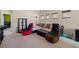 Cozy game room with theater seating, ample space for entertainment, and a relaxed atmosphere at 9457 Alma Ridge Ave, Las Vegas, NV 89178