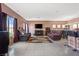 Spacious living room featuring tile floors, comfortable seating, and a bar at 9457 Alma Ridge Ave, Las Vegas, NV 89178