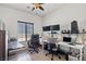 Well-lit office with two desks, multiple monitors and comfortable chairs at 9457 Alma Ridge Ave, Las Vegas, NV 89178