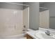 Bathroom featuring a tub and shower combo, and vanity with a white sink at 9535 Golden Scots Ct, Las Vegas, NV 89123