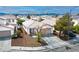Charming single-story home with a well-maintained lawn, mature trees, and a two-car garage at 9535 Golden Scots Ct, Las Vegas, NV 89123