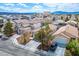 Beautiful suburban home with a well-manicured lawn, mature trees, and a spacious driveway at 9535 Golden Scots Ct, Las Vegas, NV 89123