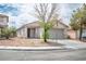 View of a cozy single-Gathering home with a two-car garage and xeriscaped front yard at 9535 Golden Scots Ct, Las Vegas, NV 89123