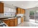 Functional kitchen with wooden cabinets, laminate countertops, and stainless-steel appliances at 9535 Golden Scots Ct, Las Vegas, NV 89123