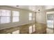 Spacious living area with tile floors, modern lighting, and sliding glass door at 9535 Golden Scots Ct, Las Vegas, NV 89123