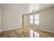 Open-concept living room with neutral tones, tile flooring, and bright, natural lighting at 9535 Golden Scots Ct, Las Vegas, NV 89123