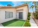 The cozy backyard patio has easy access via sliding doors and features artificial turf at 988 Flapjack Dr, Henderson, NV 89014