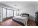 A spacious bedroom with large window and plush carpet at 988 Flapjack Dr, Henderson, NV 89014