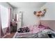 Bright bedroom featuring a vanity, a plush bed, and charming decor at 988 Flapjack Dr, Henderson, NV 89014
