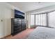 A spacious bedroom features a dark dresser and bay window at 988 Flapjack Dr, Henderson, NV 89014