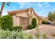 Charming home with lush landscaping, a tile roof, and a well-maintained lawn at 988 Flapjack Dr, Henderson, NV 89014