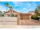 Charming single-story home featuring a well-manicured yard and a two-car garage at 988 Flapjack Dr, Henderson, NV 89014