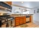 The kitchen area shows an oven, granite countertops and tile floors at 988 Flapjack Dr, Henderson, NV 89014
