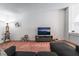 Cozy living room space with carpet, television, and decor at 988 Flapjack Dr, Henderson, NV 89014