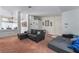 Open living room has carpeted floors with a gray sofa and plenty of natural light at 988 Flapjack Dr, Henderson, NV 89014