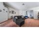 Bright living room showcases carpeted floors, neutral paint, and a comfortable gray sofa at 988 Flapjack Dr, Henderson, NV 89014