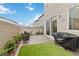 Backyard featuring pavers, artificial turf, gas grill and outdoor furniture at 10190 Natural Anchor St, Las Vegas, NV 89166