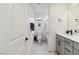 Neat bathroom featuring a single vanity with modern fixtures, toilet, and a shower/tub combo at 10190 Natural Anchor St, Las Vegas, NV 89166