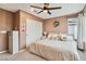 Bedroom with a bed, closet, ceiling fan and view of the window at 10190 Natural Anchor St, Las Vegas, NV 89166