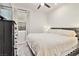 Bright bedroom featuring a large bed, dresser, neutral walls, and ample natural light from the window at 10190 Natural Anchor St, Las Vegas, NV 89166