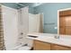 Bathroom with shower and tub, wide mirror, and light wood vanity at 10212 Donald Weese Ct, Las Vegas, NV 89129