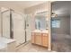 Bathroom boasting glass enclosed shower, vanity with sink, and view of adjacent bedroom space at 10212 Donald Weese Ct, Las Vegas, NV 89129