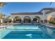 Sparkling community pool area with a covered seating area at 10212 Donald Weese Ct, Las Vegas, NV 89129