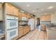 Well-equipped kitchen with stainless steel appliances and tiled flooring at 10212 Donald Weese Ct, Las Vegas, NV 89129