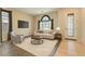 Bright living room featuring neutral tones, ample natural light, and stylish modern furnishings at 10212 Donald Weese Ct, Las Vegas, NV 89129