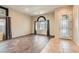 Spacious living room with large windows, neutral tones, and tile flooring at 10212 Donald Weese Ct, Las Vegas, NV 89129
