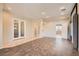 Open-concept living area with tiled floors and neutral paint at 10212 Donald Weese Ct, Las Vegas, NV 89129