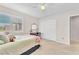 Comfortable bedroom with neutral tones, plush carpet, and a ceiling fan at 10353 Settlers Run Ave, Las Vegas, NV 89166
