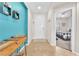 Inviting foyer with tile flooring, decorative shelves, and a view into the adjacent bedroom at 10353 Settlers Run Ave, Las Vegas, NV 89166