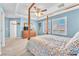 Spacious main bedroom features a four-poster bed, tray ceiling, and shuttered windows at 10353 Settlers Run Ave, Las Vegas, NV 89166