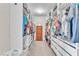 Spacious walk-in closet features custom shelving, ample storage space, and a central dresser at 10353 Settlers Run Ave, Las Vegas, NV 89166