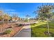 A community park has play equipment, green spaces, sidewalks, and landscaping at 10940 Oregano Ave, Las Vegas, NV 89166