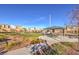 Community park with a picnic area, lawn, and attractive landscaping at 10940 Oregano Ave, Las Vegas, NV 89166
