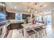 Modern kitchen features granite counters, stainless appliances, and an island with bar stool seating at 10940 Oregano Ave, Las Vegas, NV 89166
