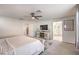 The main bedroom features a ceiling fan, walk-in closet and ensuite bathroom with glass shower at 10940 Oregano Ave, Las Vegas, NV 89166