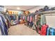 Spacious walk-in closet with ample hanging space, shelving, and room for storage at 10940 Oregano Ave, Las Vegas, NV 89166