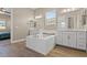 Elegant bathroom with a soaking tub, double sinks, and modern fixtures at 10972 Nicholas Jay Ave, Las Vegas, NV 89166