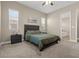Cozy bedroom with a comfortable bed, two windows and a soothing color scheme at 10972 Nicholas Jay Ave, Las Vegas, NV 89166