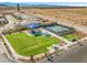 A community park features lush green space, playground, tennis court, and well-maintained landscaping for resident's enjoyment at 10972 Nicholas Jay Ave, Las Vegas, NV 89166