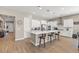 Bright, open kitchen featuring white cabinets, quartz countertops, stainless steel appliances, and a large island at 10972 Nicholas Jay Ave, Las Vegas, NV 89166