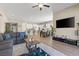 Open-concept living space featuring a modern kitchen, dining area, and comfortable living room at 10972 Nicholas Jay Ave, Las Vegas, NV 89166
