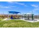 A playground is equipped with slides and a covered picnic area, perfect for a fun day in the sun at 10972 Nicholas Jay Ave, Las Vegas, NV 89166