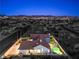 Aerial view of property featuring a sparkling pool and spa, surrounded by lush landscaping for outdoor enjoyment at 1144 Calico Ridge Dr, Henderson, NV 89011