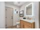 Well-lit half-bathroom featuring a modern vanity and ample space at 1144 Calico Ridge Dr, Henderson, NV 89011